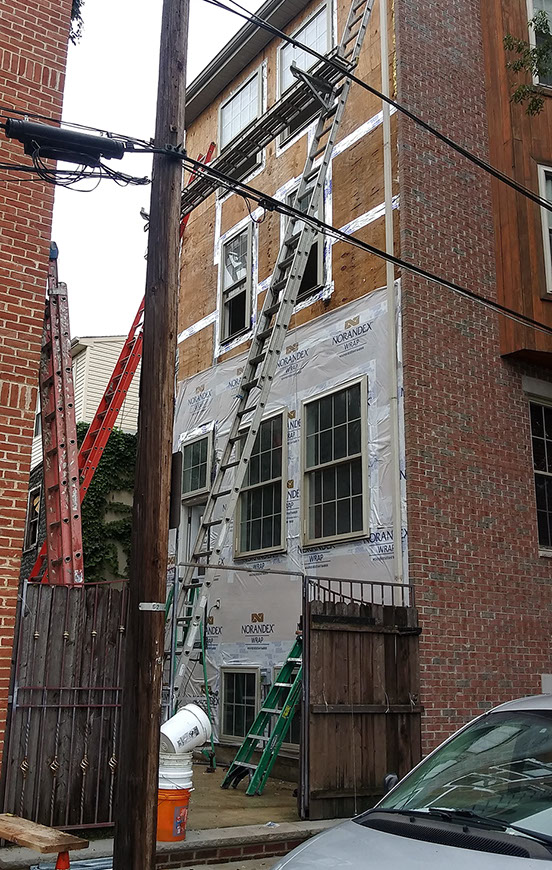 fixing a rowhome's exterior from failing stucco