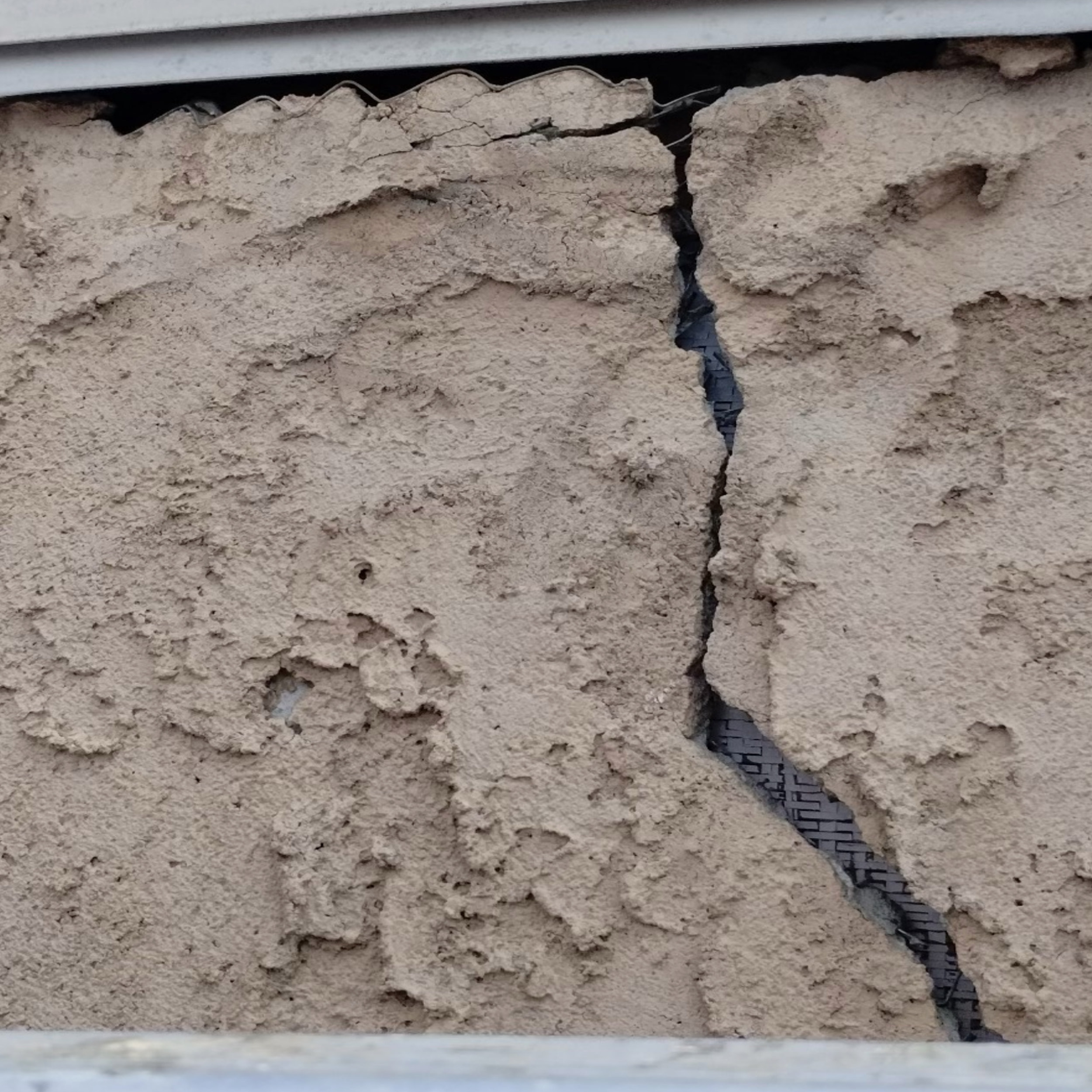 Severely Damaged Stucco